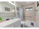 This primary bathroom offers a shower-tub combo, marble countertops, and ample storage at 2716 S Terrace Rd, Tempe, AZ 85282
