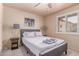 Bright bedroom featuring closet, ceiling fan, and a window with nice natural light at 2716 S Terrace Rd, Tempe, AZ 85282