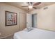 Calm bedroom has ceiling fan, and closet provides additional storage space and organization at 2716 S Terrace Rd, Tempe, AZ 85282