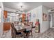 Dining area with chandelier, wood table, and tile floors at 2716 S Terrace Rd, Tempe, AZ 85282