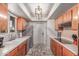 Galley kitchen featuring tile floors, stainless steel appliances, and ample cabinets at 2716 S Terrace Rd, Tempe, AZ 85282