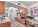 Kitchen showcasing wooden cabinets, tile flooring, and stainless steel appliances at 2716 S Terrace Rd, Tempe, AZ 85282