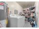 This functional laundry room is equipped with washer, dryer and plenty of storage space at 2716 S Terrace Rd, Tempe, AZ 85282