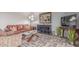 Neutral living room with stylish gray floors, leather sofa, and large artwork at 2716 S Terrace Rd, Tempe, AZ 85282