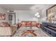 Comfortable living room featuring a leather sofa, glass coffee table, and soft lighting at 2716 S Terrace Rd, Tempe, AZ 85282