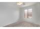 Bright bedroom with carpet, a window, and a ceiling fan at 330 S Valley Dr, Apache Junction, AZ 85120