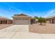 Inviting single-story home with a two-car garage and well-maintained front yard landscaping at 330 S Valley Dr, Apache Junction, AZ 85120