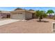 Charming single-story home featuring a two-car garage and low-maintenance desert landscaping at 330 S Valley Dr, Apache Junction, AZ 85120
