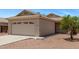 Charming single-story home featuring a two-car garage and a well-maintained, low maintenance desert landscape at 330 S Valley Dr, Apache Junction, AZ 85120