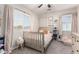 This bedroom is filled with natural light from dual windows, and features a charming decor at 34913 N 30Th Dr, Phoenix, AZ 85086