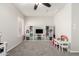This bonus room offers versatile space with a ceiling fan and plenty of natural light at 34913 N 30Th Dr, Phoenix, AZ 85086