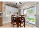 Cozy dining area with backyard access and a ceiling fan for a pleasant atmosphere at 34913 N 30Th Dr, Phoenix, AZ 85086