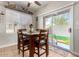 Bright dining room with modern table set, lots of light, and backyard views at 34913 N 30Th Dr, Phoenix, AZ 85086
