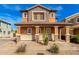 Inviting two-story home with a covered porch and desert landscaping at 34913 N 30Th Dr, Phoenix, AZ 85086
