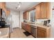 Functional kitchen with stainless steel appliances, tile flooring and ample counter space at 34913 N 30Th Dr, Phoenix, AZ 85086