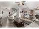 Spacious living room with wood floors and staircase, blending comfort and style at 34913 N 30Th Dr, Phoenix, AZ 85086