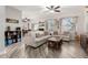 Comfortable living room with wood floors and large windows, providing ample natural light at 34913 N 30Th Dr, Phoenix, AZ 85086