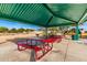 Community picnic area with tables and a grill, ideal for gatherings and outdoor dining at 34913 N 30Th Dr, Phoenix, AZ 85086