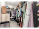 The walk-in closet includes ample shelving and hanging storage, ensuring organized living at 34913 N 30Th Dr, Phoenix, AZ 85086