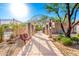 Inviting community walkway with shaded seating offers a relaxing space to enjoy the outdoors at 34913 N 30Th Dr, Phoenix, AZ 85086