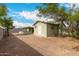 Spacious backyard featuring a storage shed, covered patio, and low-maintenance desert landscaping at 3802 N 50Th Ave, Phoenix, AZ 85031