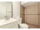 Traditional-style bathroom with white vanity and light-brown tiled shower stall at 3802 N 50Th Ave, Phoenix, AZ 85031