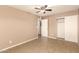 Bedroom featuring tile floors, neutral walls, and a sliding door closet at 3802 N 50Th Ave, Phoenix, AZ 85031