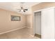 Cozy bedroom with neutral walls, ceiling fan, closet and window, providing a peaceful retreat at 3802 N 50Th Ave, Phoenix, AZ 85031