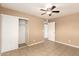 Bedroom featuring tile floors, neutral walls, and a sliding door closet at 3802 N 50Th Ave, Phoenix, AZ 85031