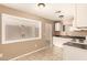 Well-lit kitchen offering a view into the adjacent living space, promoting interaction at 3802 N 50Th Ave, Phoenix, AZ 85031
