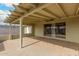 Inviting covered patio with concrete flooring and sliding glass doors to the interior space at 3802 N 50Th Ave, Phoenix, AZ 85031
