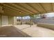 Covered patio perfect for outdoor entertaining, featuring concrete flooring and access to the backyard at 3802 N 50Th Ave, Phoenix, AZ 85031