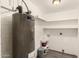 Utility room with water heater, shelving, and laundry hook-ups at 3802 N 50Th Ave, Phoenix, AZ 85031