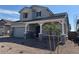 Beautiful two-story home featuring a covered porch and desert landscaping at 3811 S Bridlewood Ave, Mesa, AZ 85212