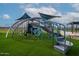 Vibrant community playground featuring modern climbing structures and shade canopies at 3811 S Bridlewood Ave, Mesa, AZ 85212