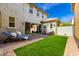 Inviting backyard featuring a lounge area, well-manicured lawn, and a shaded patio space at 3910 E Turley St, Gilbert, AZ 85295
