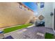 Cozy backyard featuring a paved patio, artificial turf, and outdoor seating for relaxation and entertainment at 3910 E Turley St, Gilbert, AZ 85295