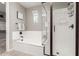 Bathroom with a separate shower and a soaking tub, complemented by neutral tones and natural light at 3910 E Turley St, Gilbert, AZ 85295