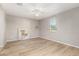 Bright bedroom with light wood flooring, ceiling fan, and natural light from a window at 3910 E Turley St, Gilbert, AZ 85295