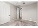 An empty bedroom with gray carpet features a ceiling fan and neutral colored walls at 3910 E Turley St, Gilbert, AZ 85295