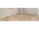 Neutral bedroom shows light wood flooring and bright natural light from two small windows at 3910 E Turley St, Gilbert, AZ 85295