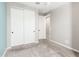 An empty bedroom with gray carpet features a closet and neutral colored walls at 3910 E Turley St, Gilbert, AZ 85295
