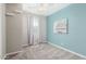 Well-lit bedroom with light blue walls, neutral carpet, a ceiling fan, and light-blocking curtains at 3910 E Turley St, Gilbert, AZ 85295