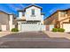 Exterior elevation of a modern two-story home with a two-car garage at 3910 E Turley St, Gilbert, AZ 85295