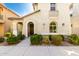 Charming home exterior featuring stucco, arched entry, and well-maintained landscaping at 3910 E Turley St, Gilbert, AZ 85295