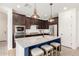 Modern kitchen island with granite countertops and stainless steel appliances at 3910 E Turley St, Gilbert, AZ 85295