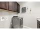 Laundry room with cabinets and modern washer and dryer at 3910 E Turley St, Gilbert, AZ 85295