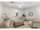 Bright living room with neutral tones, comfortable seating, and a large window at 3910 E Turley St, Gilbert, AZ 85295