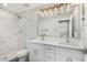 This bathroom boasts double sinks, marble tile, and updated vanity lights at 3933 W Nancy Ln, Phoenix, AZ 85041