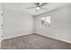 Cozy bedroom with neutral carpet, painted brick wall, and a modern ceiling fan at 3933 W Nancy Ln, Phoenix, AZ 85041